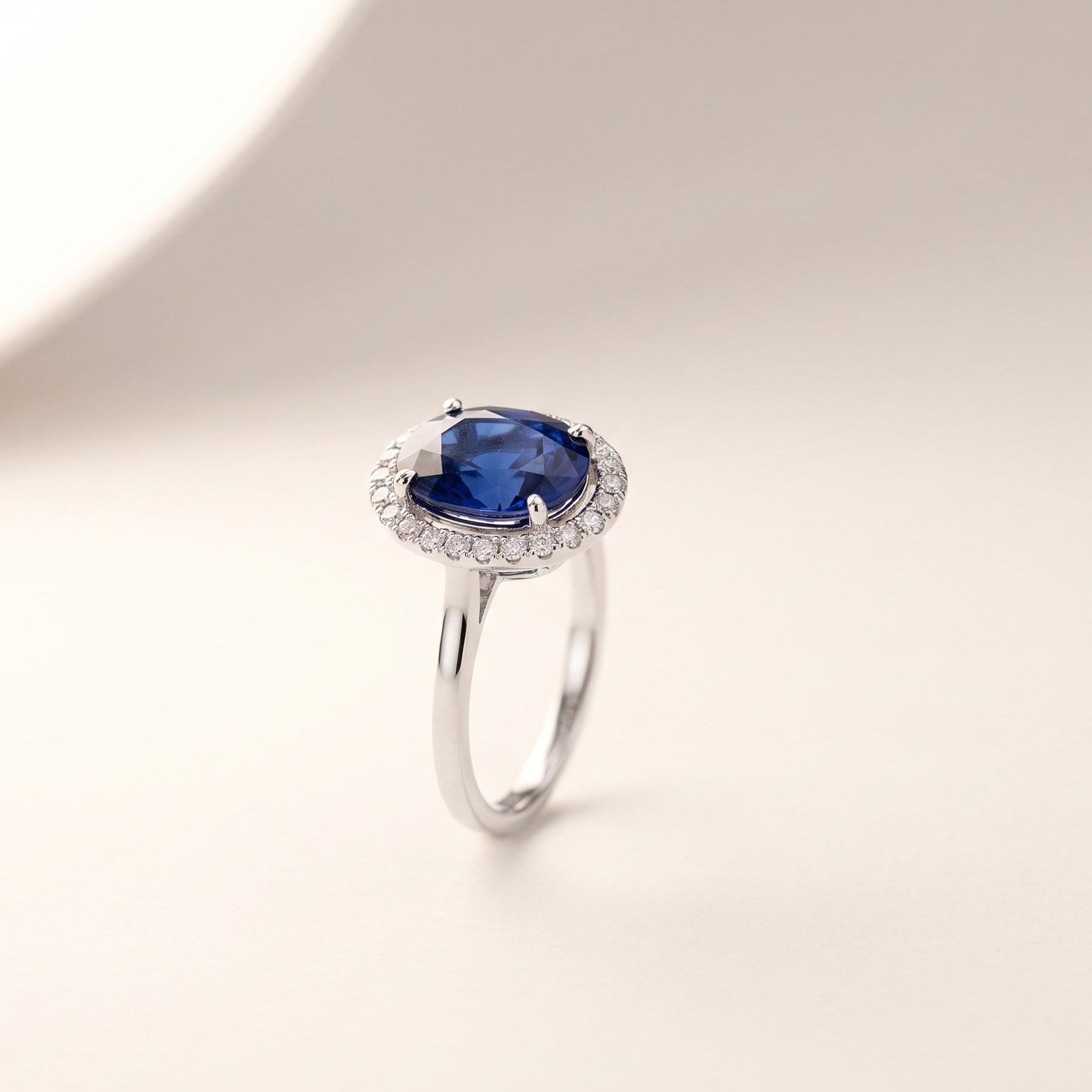 Sapphire Halo Ring, in 18k White Gold with a Blue Sapphire