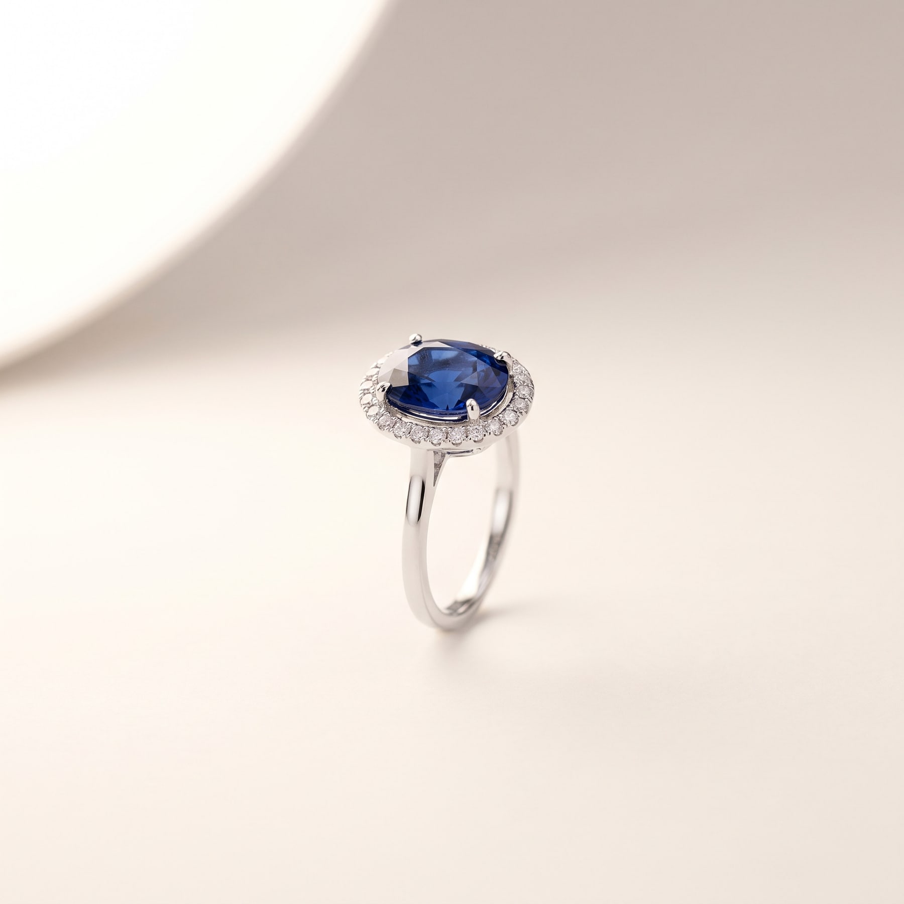 Sapphire Halo Ring, in 18k White Gold with a Blue Sapphire